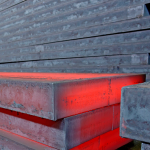 Stockpile of duplex stainless steel slabs used in reducing depression & cracking